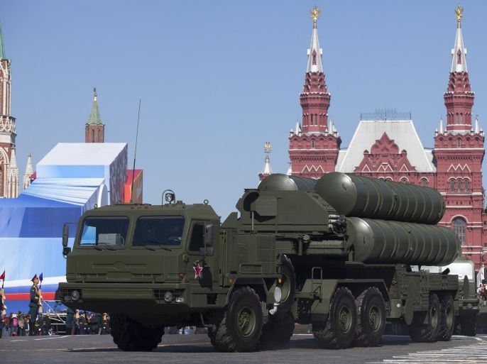 FILE - In this Tuesday May 7, 2013 file photo, Russian S-400 air defense missile systems make their way through Red Square during a rehearsal for the Victory Day military parade in Moscow, Russia. In a move raising the potential threat of a Russia-NATO conflict, Russia said Wednesday Nov. 24, 2015 it will deploy long-range air defense missiles to its base in Syria and destroy any target that may threaten its warplanes following the downing of a Russian military jet by Turkey. (AP Photo/Alexander Zemlianichenko, File)