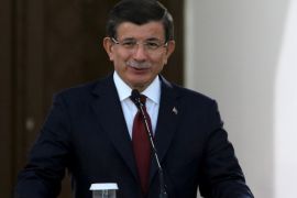 Turkish Prime Minister Ahmet Davutoglu speaks to the media during a visit to northern Cyprus, December 1, 2015.Turkey will not hesitate to take "necessary steps" for a permanent solution to the partition of Cyprus, Prime Minister Ahmet Davutoglu said on Tuesday. REUTERS/Yiannis Kourtoglou