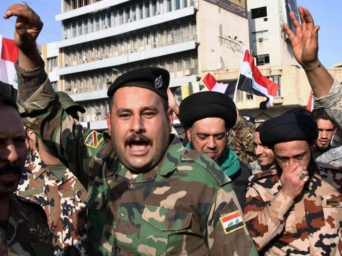 Members of Iraqi Shiite Badr Army militia chant slogans during a protest in Tahrir Square, central Baghdad, Iraq, 12 December 2015. According to local reports hundreds of Iraqi protesters belonging to Shiite militias staged a demonstration denouncing Turkeys deployment of military forces near the embattled northern city of Mosul. The protesters called for the immediate withdrawal of Turkish troops from Iraq. Tensions are growing between Baghdad and Ankara over the training of Kurdish troops by Turkish forces near the northern Iraqi city of Mosul, which is controlled by the group calling themselves the Islamic State (IS).
