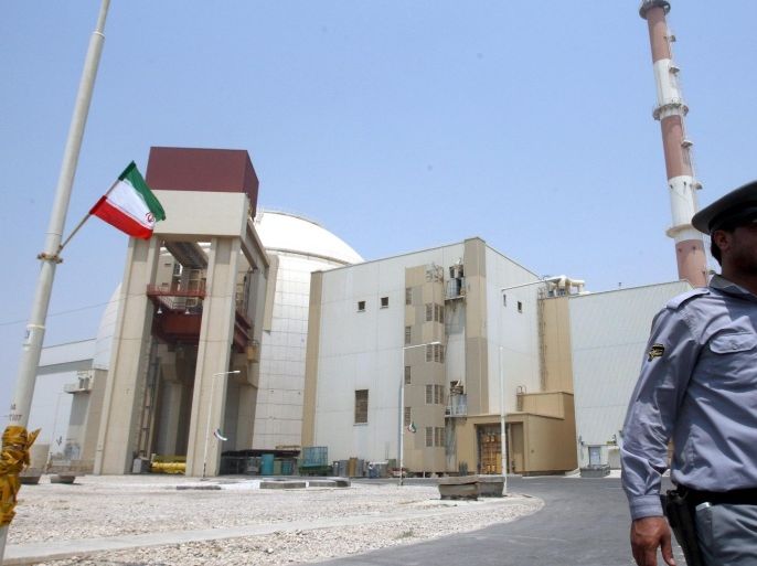 (FILE) A file photograph showing an Iranian security officer walking in front of the nuclear power plant in Bushehr , southern Iran on 21 August 2010. Media reports on 15 December 2015 state that the 35 countries on the governing board of the International Atomic Energy Agency (IAEA) unanimously took note of the agency's recent final report on its inquiry, which found that Iran had conducted various nuclear weapons research projects that have now ended. EPA/ABEDIN TAHERKENAREH *** Local Caption *** 51186417