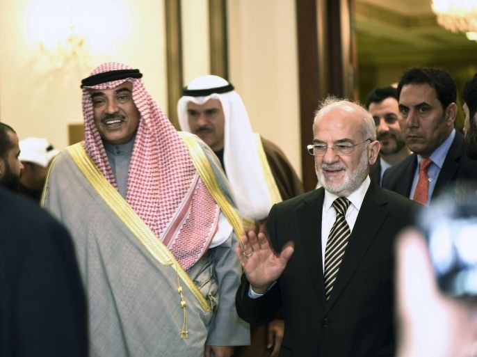 Kuwait Minister of Foreign Affairs Sheikh Sabah alKhalid al Sabah (L) and Iraq's Foreign Affairs Minister Ibrahim AlJaafari (R) enter a news briefing in Kuwait City, Kuwait, December 22, 2015. Iraq's foreign minister denied on Tuesday that his government had anything to do with the kidnapping of a group of Qatari hunters in the south of the country this month. REUTERS/Stephanie McGehee