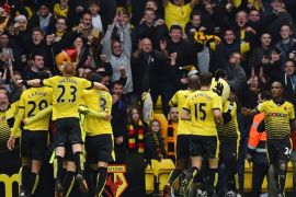 JR514 - Watford, Hertfordshire, UNITED KINGDOM : Watford's Nigerian striker Odion Ighalo (R) celebrates with teammates after scoring their third goal during the English Premier League football match between Watford and Liverpool at Vicarage Road Stadium in Watford, north of London on December 20, 2015. Watford won the game 3-0. AFP PHOTO / BEN STANSALL