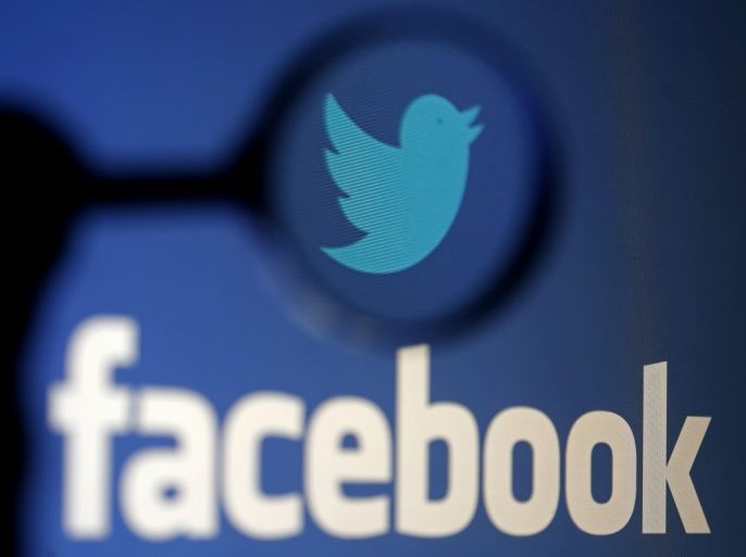A logo of Twitter is pictured next to the logo of Facebook in this September 23, 2014 illustration photo in Sarajevo. Facebook, Google and Twitter are stepping up efforts to combat online propaganda and recruiting by Islamic militants, but the Internet companies are doing it quietly to avoid the perception that they are helping the authorities police the Web. REUTERS/Dado Ruvic/Files