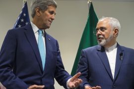FILE - In this Sept. 26, 2015 file photo, Secretary of State John Kerry meets with Iranian Foreign Minister Mohammad Javad Zarif at United Nations headquarters. Congressional Republicans are criticizing the Obama administration over its reassurances to Iran about new visa rules. At issue is a new law tightening visa-free travel to the U.S. The measure was part of a spending bill passed by Congress last week and signed by President Barack Obama. It requires visas for citizens of Iraq, Syria, Iran and Sudan, as well as recent visitors to those countries. (AP Photo/Craig Ruttle, File)