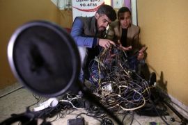 Palestinian journalists inspect the damage of the Al-Khalil radio station in the West Bank city of Hebron, 21 November 2015. Israeli forces on 03 November raided the radio station in the West Bank city of Hebron and ordered it shut down for six months, Palestinian officials said. Journalist Amjad Shawar, the director of the station, Al-Khalil 90.4 FM, said a large army unit marched into the station's office in the Palestinian-controlled section of Hebron and seized equipment before handing the staff a closing order.