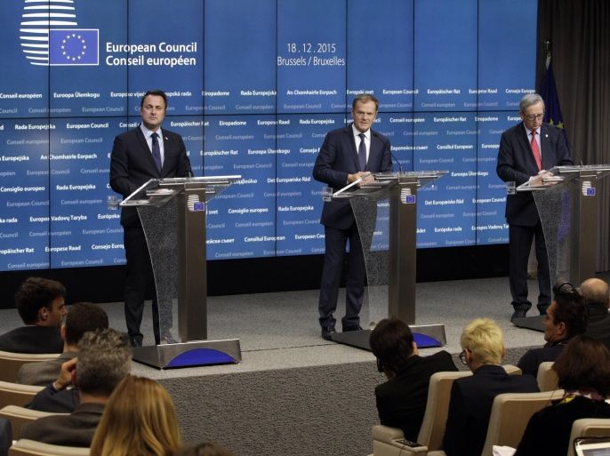 European Council President Donald Tusk, center, speaks during a media conference at the conclusion of an EU summit in Brussels on Friday, Dec. 18, 2015. European Union leaders reconvened in Brussels for the final day of their year-end summit with a wide-ranging agenda including how to build greater economic unity among their 28 countries and stepping up the fight against extremism. At left is Luxembourg's Prime Minister Xavier Bettel and at right is European Commission President Jean-Claude Juncker. (AP Photo/Francois Walschaerts)