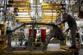 Employees work on a Renault Sandero at an assembly line of a car maker plant, which produces Renault automobiles, in Moscow, Russia, in this May 15, 2012 file photo. A steep decline in the rouble has hammered Russian carmakers by driving up the cost of the foreign parts they rely on, forcing them to raise prices at home and making them uncompetitive abroad. After a decade of annual sales growth in excess of 10 percent, the Russian car industry is now a victim of an economic crisis fuelled by lower oil prices and Western sanctions over Moscow's role in the Ukraine crisis. To match Analysis story RUSSIA-CRISIS/AUTOS REUTERS/Maxim Shemetov/Files
