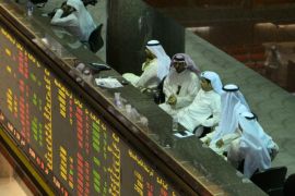 Traders sit at Kuwait Stock Exchange, Kuwait City, Kuwait, 24 August 2015. Shares, commodities and currencies have all suffered losses over rising fears over CHina's economy and the country's Government's ability to handle the crisis.