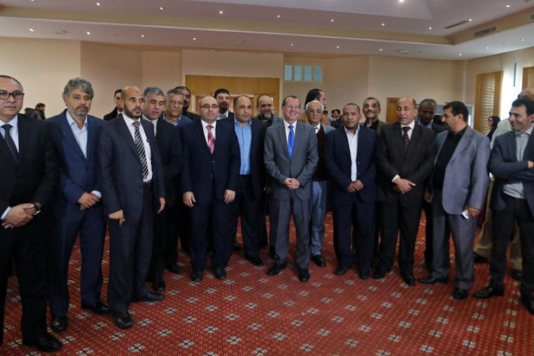 UN envoy for Libya, Martin Kobler (C), poses with representatives of Libyan municipalities and municipal council after their meeting in Tunis, Tunisia, 21 December 2015. An agreement was signed by 24 mayors to support Libya's new national government and its head, Fayez al-Sarraj, and the UN Libyan Political Agreement (LPA). Though the signing 17 December, aimed at ending the countries ongoing civil war, was greeted with great fanfare in Morocco, many have doubts abouts its implimentation as some within the rival Governments not present at the signing and the plethora of warring factions seem likely to ignore its proposals for the formation of a unity Government, calling it illegitimate and imposed by external powers.