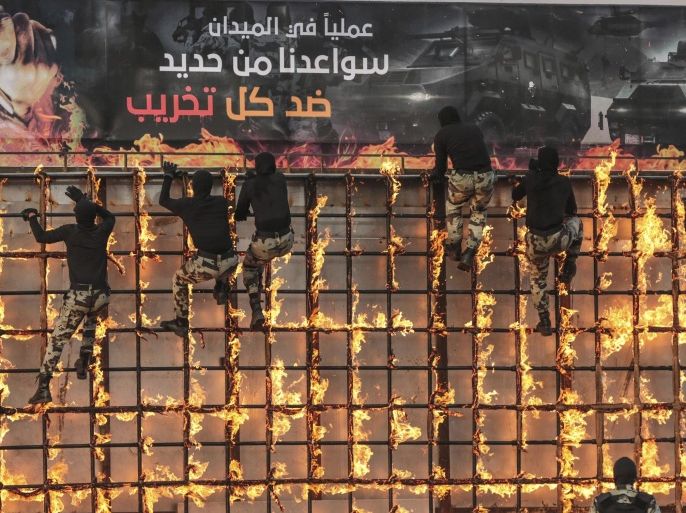 Saudi security forces show their skills while taking part in a military parade in preparation for the annual Hajj pilgrimage in Mecca, Saudi Arabia, Thursday, Sept. 17, 2015. (AP Photo/Mosa'ab Elshamy)