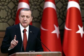 Turkey's President Recep Tayyip Erdogan addresses a meeting in Ankara, Turkey, Thursday, Dec. 3, 2015. Russia's President Vladimir Putin on Thursday hinted at more sanctions against Turkey and accused Turkey of a "treacherous war crime" in downing a Russian jet at the border with Syria. Erdogan has hotly denied that his country was involved in oil trade with the Islamic State group , and has pledged to step down if Moscow proves its accusations.(Yasin Bulbul, Presidential Press Service, Pool via AP)