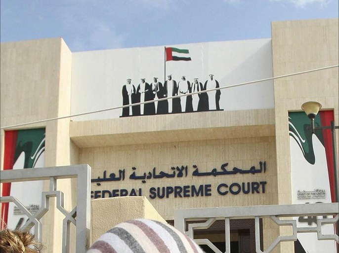 Khalifa Al Nuaimi (2nd R), a relative of convicted political activist Nasser bin Ghaith, speaks to the media outside the federal supreme court in Abu Dhabi in this November 27, 2011 file photo. In the UAE, the crackdown focused on Islamists suspected of plotting to set up an Islamist state but also included liberal activists in its net. Five activists among a group of some 130 people who signed a petition demanding reforms were arrested in April 2011 and charged with insulting the country's rulers. The UAE maintains that it was the insults that some members had directed at its leaders, rather than the petition, that prompted the arrests. To match Feature GULF-RIGHTS/ REUTERS/Nikhil Monteiro/Files (UNITED ARAB EMIRATES - Tags: CRIME LAW POLITICS CIVIL UNREST)