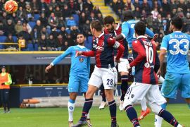 VIP005 - Bologna, -, ITALY : Bologna's defender from Italy Luca Rossettini (C) scores against Napoli during the Italian Serie A football match Bologna vs Napoli at the Dall'Ara stadium in Bologna on December 6, 2015. AFP PHOTO / VINCENZO PINTO