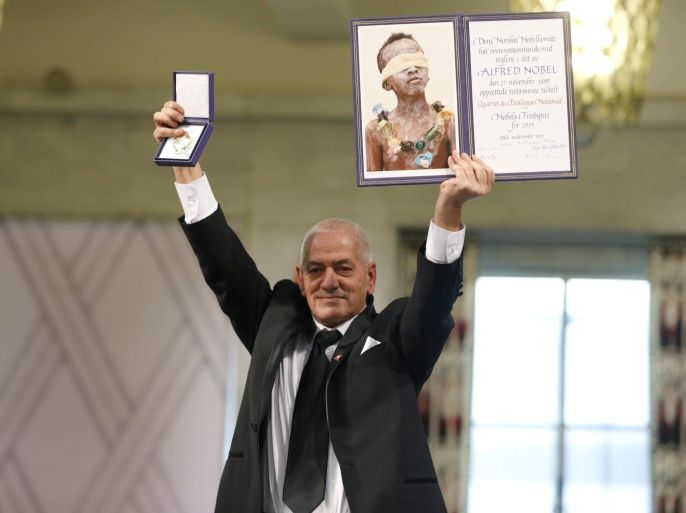 Secretary General of the Tunisian General Labour Union (UGTT), Houcine Abassi holds up the diploma and medallion at the Nobel Peace Prize 2015 award ceremony in Oslo, Norway, 10 December 2015. The Tunisian National Dialogue Quartet was awarded the 2015 Nobel Peace Prize for its decisive contribution to the building of a pluralistic democracy in Tunisia in the wake of the Jasmine Revolution of 2011. EPA/CORNELIUS POPPE NORWAY OUT
