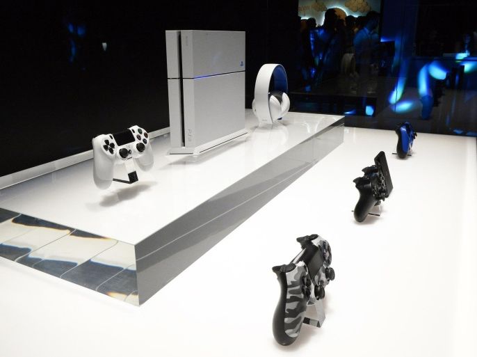 PlayStation 4 console and controllers and a headphone are displayed at the 2014 Electronic Entertainment Expo, known as E3, in Los Angeles, California in this June 11, 2014 file picture. Sony Corp should fear China's censors almost as much as rival Microsoft Corp as it prepares to unveil the price and release date of its PlayStation 4 gaming console in the world's third-largest gaming market. REUTERS/Kevork Djansezian/Files (UNITED STATES - Tags: SOCIETY BUSINESS POLITICS)