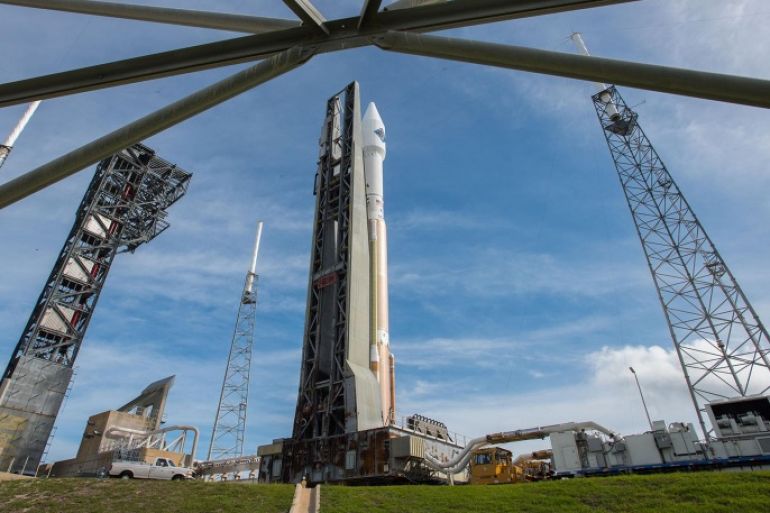 In this photo provided by the United Launch Alliance, an Atlas V rocket carrying the Orbital ATK Cygnus spacecraft, is rolled from the Vertical Integration Facility to a launch pad at the Cape Canaveral Air Force Station in Cape Canaveral, Fla., on Wednesday, Dec. 2, 2015. Orbital's Antares rocket is still grounded following a 2014 launch explosion that damaged a Virginia launch pad. (United Launch Alliance via AP)