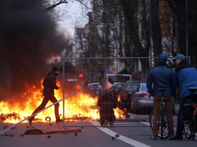 Left-wing counter-protesters set barricades on fire during clashes with police at a rally of the party 'Die Rechte' (The Right) in Leipzig, Germany, 12 December 2015. The rally of the right-wing extremists across a district of the city considered left-leaning was met with strong protests.