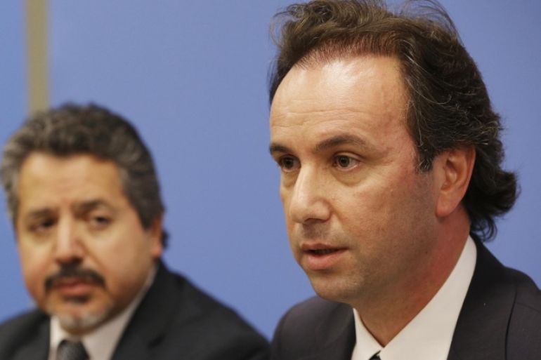 FILE - In this Wednesday, Sept. 30, 2015, file photo, president of the Syrian National Coalition Khaled Khoja, right, is joined by Syrian National Coalition Special Representative to the U.S. and the United Nations Najib Ghadbian as he speaks to reporters during a news conference, at U.N. headquarters. Saudi Arabia will be hosting the Syrian opposition and some insurgent groups next week as preparations come underway for peace talks between President Bashar Assad government and his opponents by the beginning of next year to try end Syria's deadly civil war. (AP Photo/Mary Altaffer, File)