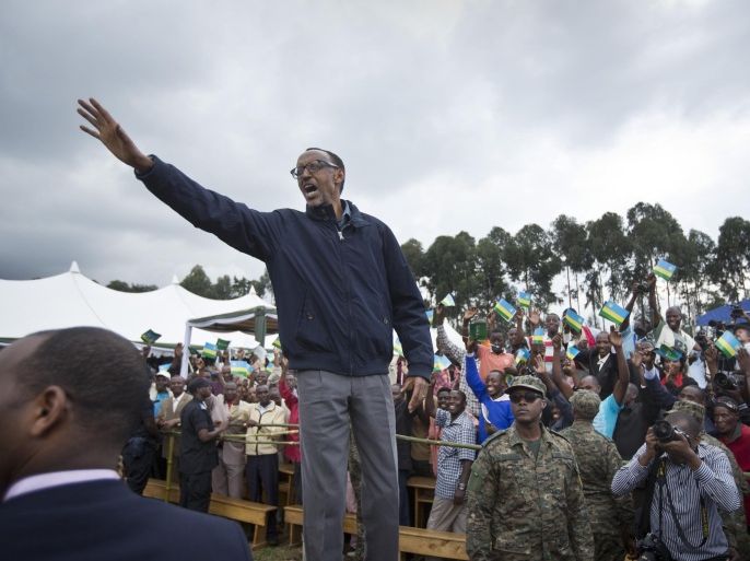 FILE - In this Saturday, Sept. 5, 2015 file photo, Rwanda's President Paul Kagame waves to the crowd before speaking at a baby gorilla naming ceremony in Kinigi, northern Rwanda. Rwanda will vote on Dec. 18, 2015 in a referendum which would allow President Paul Kagame to run again for re-election when his current seven-year term ends in 2017, as he is currently ineligible because the Rwandan constitution limits a president to two terms. (AP Photo/Ben Curtis, File)