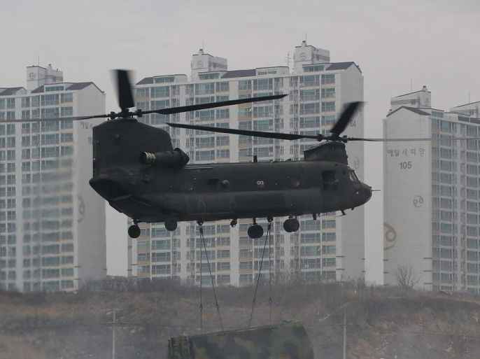 A CH-47 Chinook helicopter carries a floating bridge during a river crossing operation as part of a South Korea-US joint military exercise in Yeoncheon, just south of the inter-Korean border, South Korea, 10 December 2015. It was the last day of the exercise by the two allies that began on 01 December. EPA/YONHAP SOUTH KOREA OUT
