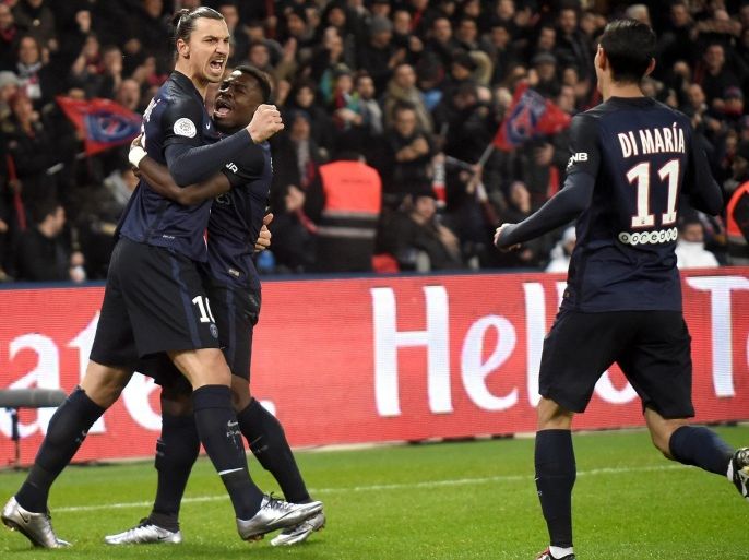 Paris Saint Germain player Zlatan Ibrahimovic celebrates with Serge Aurier and Angel di Maria after his goal during the French soccer Ligue 1 match between Paris Saint Germain (PSG) and Olympique Lyonnais (OL) at the Parc des Princes stadium in Paris, France, 13 December 2015.