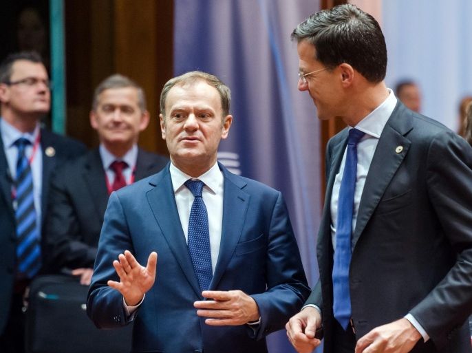 European Council President Donald Tusk, left, speaks with Dutch Prime Minister Mark Rutte during a round table meeting an EU summit in Brussels on Friday, Dec. 18, 2015. European Union leaders are reconvening in Brussels for the final day of their year-end summit with a wide-ranging agenda including how to build greater economic unity among their 28 countries and stepping up the fight against terrorism. (AP Photo/Geert Vanden Wijngaert)