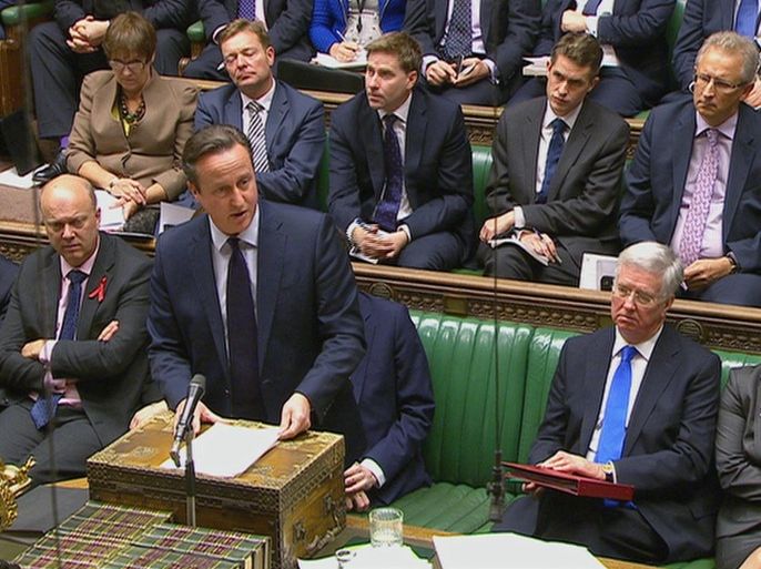 British Prime Minister David Cameron talks to lawmakers inside the House of Commons in London during a debate on launching airstrikes against Islamic State extremists inside Syria, Wednesday, Dec. 2, 2015. The parliamentary vote is expected Wednesday evening. (Parliamentary Recording Unit via AP Video) TV OUT - NO ARCHIVE