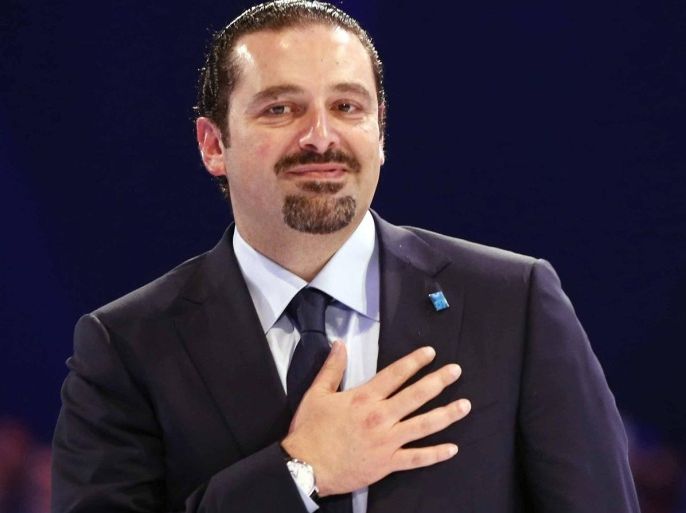 Lebanon's former prime minister Saad al-Hariri gestures during the 10th anniversary of his father's assassination, in Beirut February 14, 2015. Al-Hariri made a rare visit to his country on Saturday, attending a ceremony to mark the 10th anniversary of his father Rafik's assassination, live television footage showed. He was expected to speak at the ceremony dedicated to his father, who was killed in a 2005 Beirut waterfront bombing that brought the country back to the brink of civil war. REUTERS/Mohamed Azakir (LEBANON - Tags: POLITICS ANNIVERSARY)