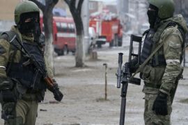 In this Jan. 20, 2014, file photo Russian special force soldiers wear masks during an anti-terrorist operation in Makhachkala, regional capital of Dagestan, Russia. The Russian province of Dagestan, a flashpoint for Islamic violence in the North Caucasus, is feeding hundreds of fighters to the Islamic State in Syria, officials say--and now some are coming back home with experience gained from the battlefield. (Abdula Magomedov/NewsTeam via AP, File)