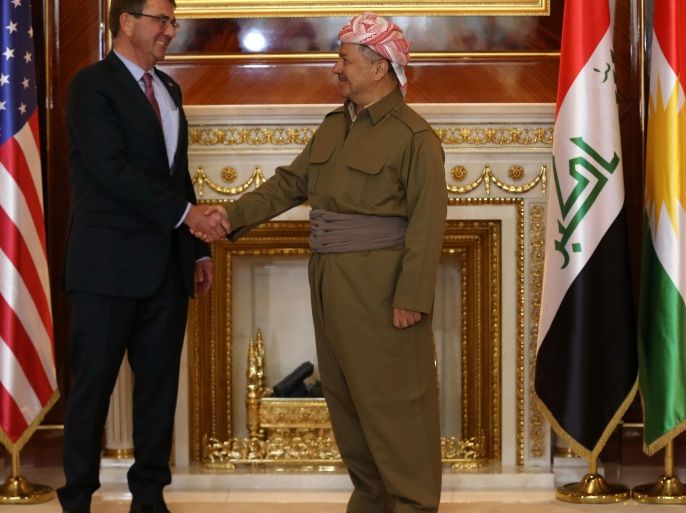 Iraqi Kurdish leader Massud Barzani (R) shakes hands with US Defence Secretary Ashton Carter before a meeting on December 17, 2015 in Arbil, the capital of the Kurdish autonomous region in Northern Iraq. Iraqi Kurdish forces are a key US partner in the war against the Islamic State group, which overran large parts of Iraq last year. AFP PHOTO / SAFIN HAMED