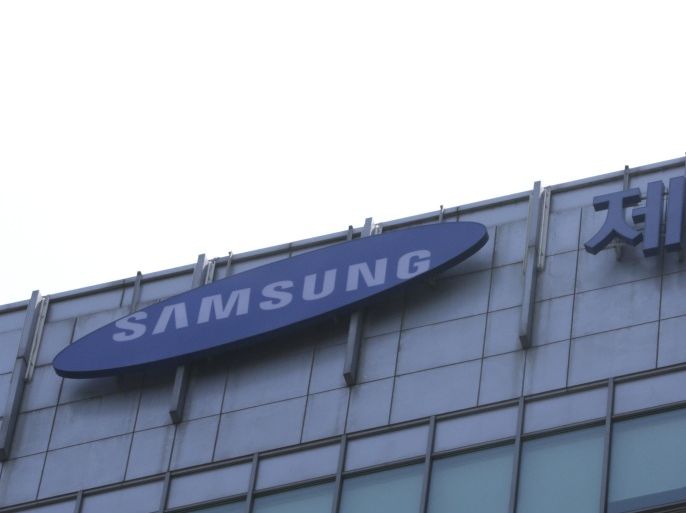 FILE - In this May 26, 2015 file photo, the sign of Cheil Industries Inc., right, is seen on the top of the building in Seoul, South Korea. South Korea's financial regulator said Friday, Dec. 4, 2015 it has launched an investigation into possible insider trading by Samsung executives related to a contentious takeover deal. South Korea's Yonhap News reported that nine Samsung executives purchased as much as 50 billion won ($43 million) of Cheil Industries stock before Samsung announced a deal to combine Cheil and another Samsung company in May. (AP Photo/Lee Jin-man,File)