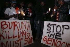 Kenyan activists and Burundian expatriates hold placards and candles during a candlelight vigil held for Burundi in Nairobi, Kenya, 13 December 2015. Kenyan activists and Burundians residing in Kenya held a candlelight service to call for peace in Burundi, that has been gripped by violence between police and armed groups since April, when President Pierre Nkurunziza announced he would seek a third term in office. Human rights activists say more than 240 people have been killed in protests and attacks since April, while more than 220,000 are believed to have fled the country.