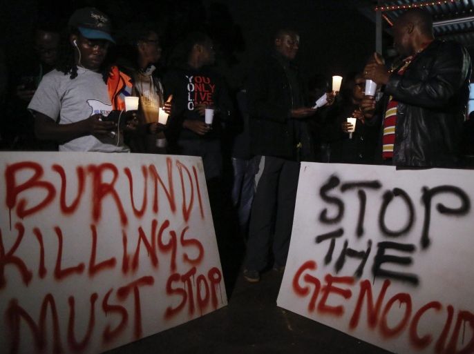 Kenyan activists and Burundian expatriates hold placards and candles during a candlelight vigil held for Burundi in Nairobi, Kenya, 13 December 2015. Kenyan activists and Burundians residing in Kenya held a candlelight service to call for peace in Burundi, that has been gripped by violence between police and armed groups since April, when President Pierre Nkurunziza announced he would seek a third term in office. Human rights activists say more than 240 people have been killed in protests and attacks since April, while more than 220,000 are believed to have fled the country.