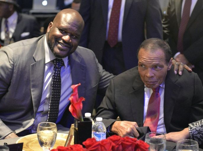 Former heavyweight boxing champion Muhammad Ali, right, and Shaquille O'Neal pose for photos during the Sports Illustrated Legacy Awards Thursday, Oct. 1, 2015, in Louisville, Ky. Sports Illustrated announced that it will dedicate the franchise's Sportsman Legacy Award in the name of boxing legend Muhammad Ali. (AP Photo/Timothy D. Easley)