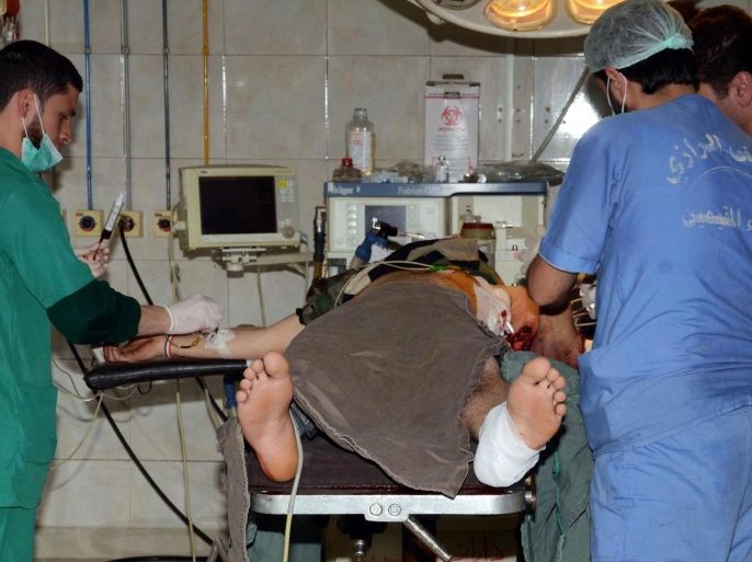 A handout picture provided by the Syrian Arab News Agency (SANA) shows doctors operating on an injured civilian at a hospital in Aleppo, Syria, 24 March 2015. According to media reports, shelling by Syrian opposition groups on the Government held Aleppo neighborhood of al-Jamiliyeh and Baroun Street killed 12 civilians and wounded up to 30 others. EPA/SYRIAN ARAB NEWS AGENCY / HANDOUT