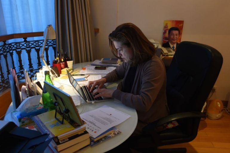 GB5056 - Beijing, -, CHINA :  Ursula Gauthier, the Beijing-based correspondent for French news magazine L'Obs, works at her desk in her apartment in Beijing on December 26, 2015. China confirmed the imminent expulsion of Gauthier in the first such case since 2012, accusing her of "flagrantly championing" terrorist acts in a statement on its foreign ministry's website on December 26. AFP PHOTO / GREG BAKER