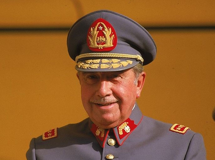 FILE - In this Oct. 1983, file photo, General Augusto Pinochet is seen in Santiago, Chile. Retired members of the armed forces and civilians commemorated Wednesday, Nov. 25, 2015, Pinochet's one hundredth birthday at the dictator's former summer retreat outside Santiago. Pinochet took power in a 1973 coup that deposed the democratically elected government of President Salvador Allende. (AP Photo/Di Baia, File)