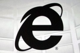 This June 4, 2012 photo shows the Microsoft Internet Explorer logo projected on a screen during the Microsoft Xbox E3 media briefing in Los Angeles. After 20 years of competing against rival web browsers, Microsoft is close to launching its own alternative to its once-dominant Internet surfing program. (AP Photo/Damian Dovarganes)