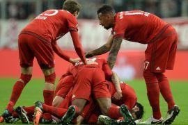 Munich's Xabi Alonso (C, bottom) celebrates with team mates after scoring a goal during the DFB Cup soccer match between Bayern Munich and Darmstadt 98 at Allianz Arena in Munich, German, 15 December 2015.(EMBARGO CONDITIONS - ATTENTION: The DFB prohibits the utilisation and publication of sequential pictures on the internet and other online media during the match (including half-time).