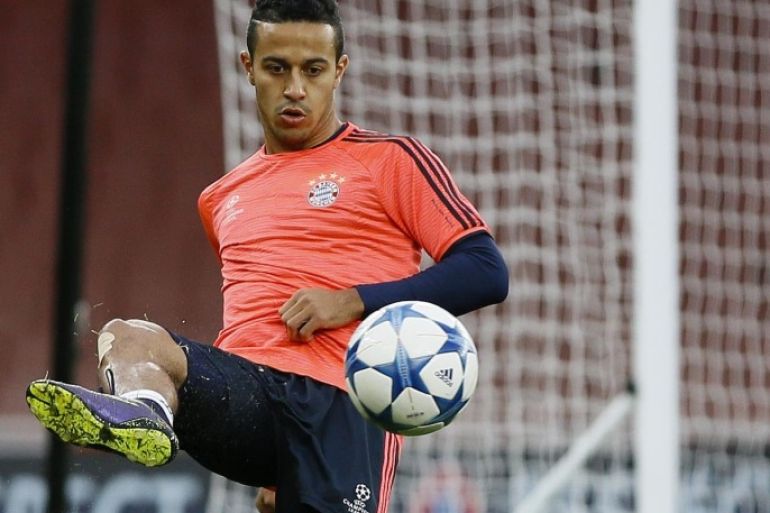 Bayern's Thiago Alcantara controls the ball during a soccer training session at Emirates stadium in London Monday, Oct. 19, 2015. Arsenal will play Bayern Munich in a Champions League Group F soccer match at the stadium on Tuesday. (AP Photo/Kirsty Wigglesworth)