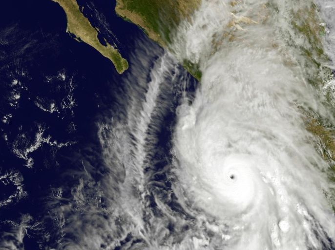 This satellite image taken at 1:45 p.m. EDT on Friday, Oct. 23, 2015, and released by NASA, shows the eastern quadrant and pinhole eye of Hurricane Patricia moving towards southwestern Mexico. The Category 5 storm is strongest ever in the Western Hemisphere, according to forecasters. (NOAA GOES Project/NASA via AP)