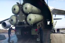 This photo made from the footage taken from Russian Defense Ministry official web site on Friday, Nov. 27, 2015, shows a Russian S-400 air defense missile systems being unloaded from an An-124 Ruslan cargo plane at the Hemeimeem air base in Syria, about 50 kilometers (30 miles) south of the border with Turkey. Russia’s President Vladimir Putin has ordered the deployment of the S-400s to the Russian base in Syria to help protect Russian warplanes after Turkey downed a Russian military jet at the border with Syria on Tuesday. (Russian Defense Ministry Press Service pool photo via AP)