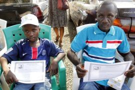 A Liberian man and his son display their survivor certificates after being officially discharged from the ELWA Ebola Treatment Unit in Monrovia, Liberia, 03 December 2015. Three new cases of Ebola have been confirmed in Liberia less than three months after the country was declared free of the virus, the World Health Organization (WHO) has said.