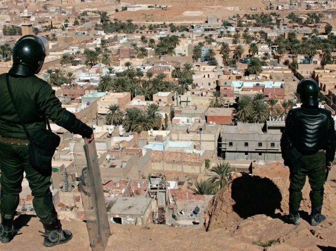 Algerian police officers watch over the desert city of Ghardaia, southern Algeria, after a Berber died of his wounds on Thursday, Ghardaia, Saturday, Feb. 8, 2014. Weeks of sectarian tension in a southern desert city is boiling over after the deaths of two Berber men in as many days, including one that a local politician said was killed in a street fight as police stood by. Ghardaia, on edge for months, is divided between Algeria’s Mozabites, members of North Africa’s original Berber inhabitants, and Sunni Muslim Arab migrants. (AP Photo/Anis Belghoul)