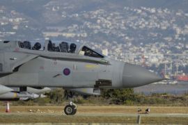A British tornado warplane passes on the runway at the RAF Akrotiri, a British air base near costal city of Limassol, Cyprus, Thursday, Dec. 3, 2015 after an airstrike. British warplanes carried out airstrikes in Syria early Thursday, hours after Parliament voted to authorize air attacks against Islamic State group targets there. (AP Photo/Pavlos Vrionides)