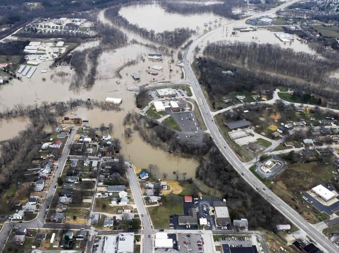 Submerged roads and houses are seen after several days of heavy rain led to flooding, in an aerial view over Union, Missouri, December 29, 2015. A storm system that triggered deadly tornadoes and flooding in the U.S. Midwest and Southwest pushed north on Tuesday, bringing snow and ice from Iowa to Massachusetts and another day of tangled air travel. REUTERS/Kate Munsch TPX IMAGES OF THE DAY