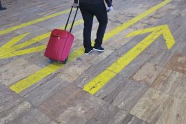 A passenger rolls a suitcase in the check in area of Barcelona's El Prat airport, March 27, 2015. The German pilot believed to have deliberately crashed a plane in the French Alps killing 150 people broke off his training six years ago due to depression and spent over a year in psychiatric treatment, a German newspaper reported on Friday.The story in German tabloid Bild came a day after French prosecutors said they believed Andreas Lubitz, a 27-year-old co-pilot at Lufthansa's budget airline Germanwings, had locked the captain out of the cockpit and steered the Airbus A320 airliner into its fatal descent. REUTERS/Albert Gea