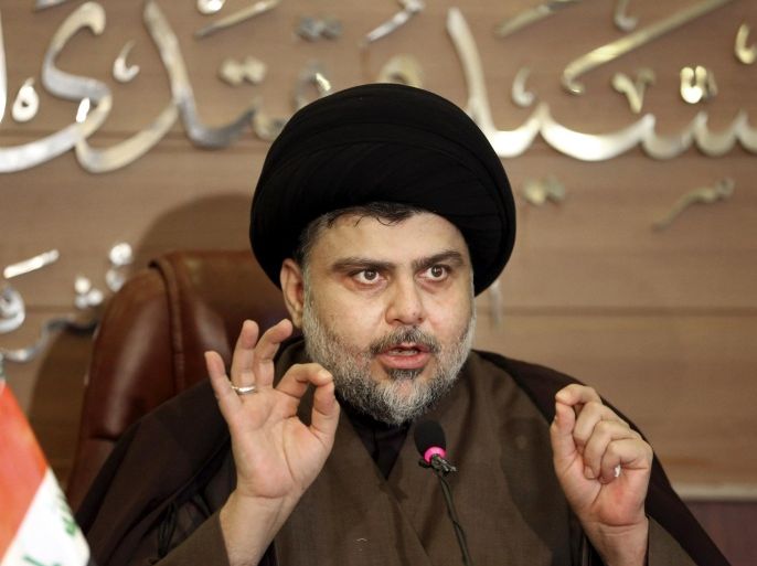 Shiite cleric Muqtada al-Sadr speaks during a press conference in the Shiite holy city of Najaf, 100 miles (160 kilometers) south of Baghdad, Iraq, Tuesday, Dec. 29, 2015. Al-Sadr congratulated the Iraqi people a day after Iraqi security forces regain control of Ramadi. (AP Photo/Karim Kadim)