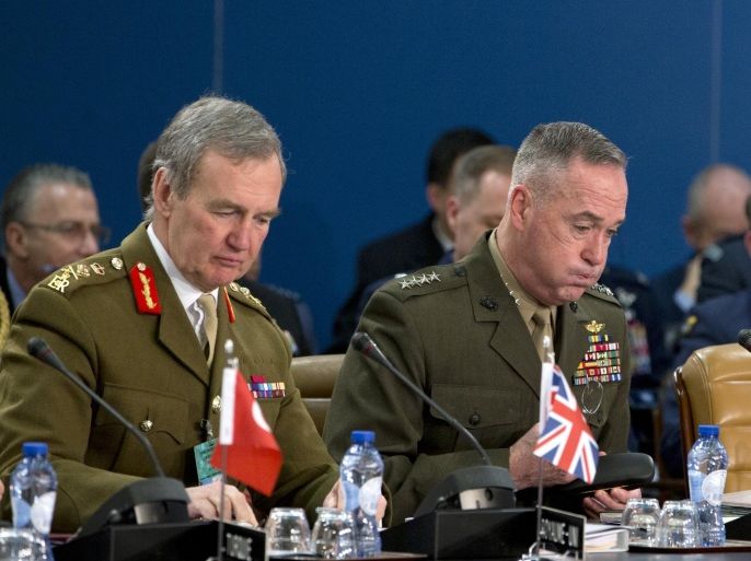 Chairman of the Joint Chiefs of Staff, US Gen. Joseph F. Dunford, center, and British Gen. Sir Nicholas Houghton, second left, participate in a meeting of NATO's Military Committee at NATO headquarters in Brussels on Thursday, Jan. 21, 2016. In a one day meeting, NATO chiefs of defense will discuss issues of strategic importance to the Alliance ahead of the forthcoming Defense Ministers’ meeting in February. (AP Photo/Virginia Mayo)