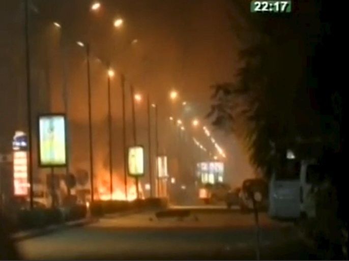 Fire and smoke rising from Splendid Hotel in Ouagadougou where suspected Islamist fighters are holding hostages in this still image from a video grab, January 15, 2016. Security forces in Burkina Faso battled suspected Islamist fighters outside the hotel in the capital's business district on Friday, gendarmes and witnesses sources said. REUTERS/RTB via REUTERS TV â€¨â€¨ATTENTION EDITORS - FOR EDITORIAL USE ONLY. NOT FOR SALE FOR MARKETING OR ADVERTISING CAMPAIGNS. NO USE/DIGITAL DISPLAY AFTER 23:29 FEBRUARY 14, 2016. BURKINA FASO OUT. NO COMMERCIAL OR EDITORIAL SALES IN BURKINA FASO. NO RESALES. NO ARCHIVES.